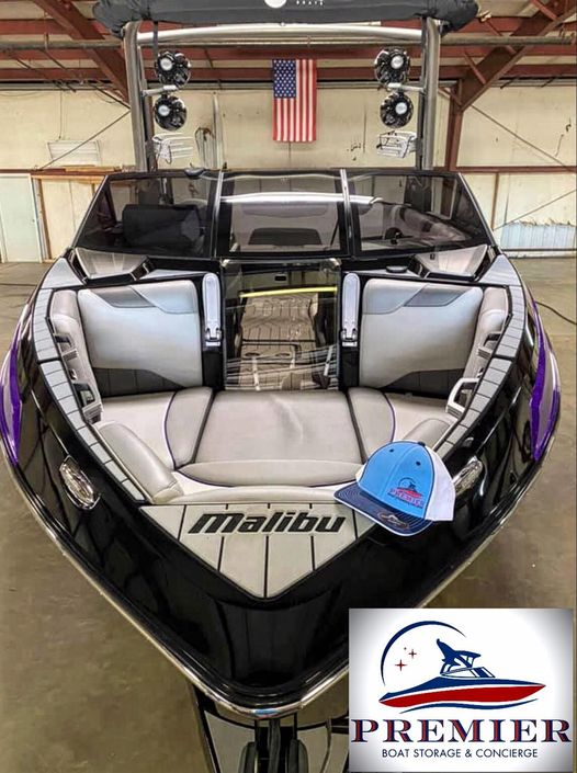 A white & black color boat with the logo