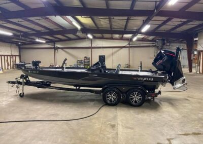 A black color motors boat on the floor